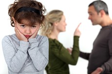 cute little girl distressed over parents' quarrel